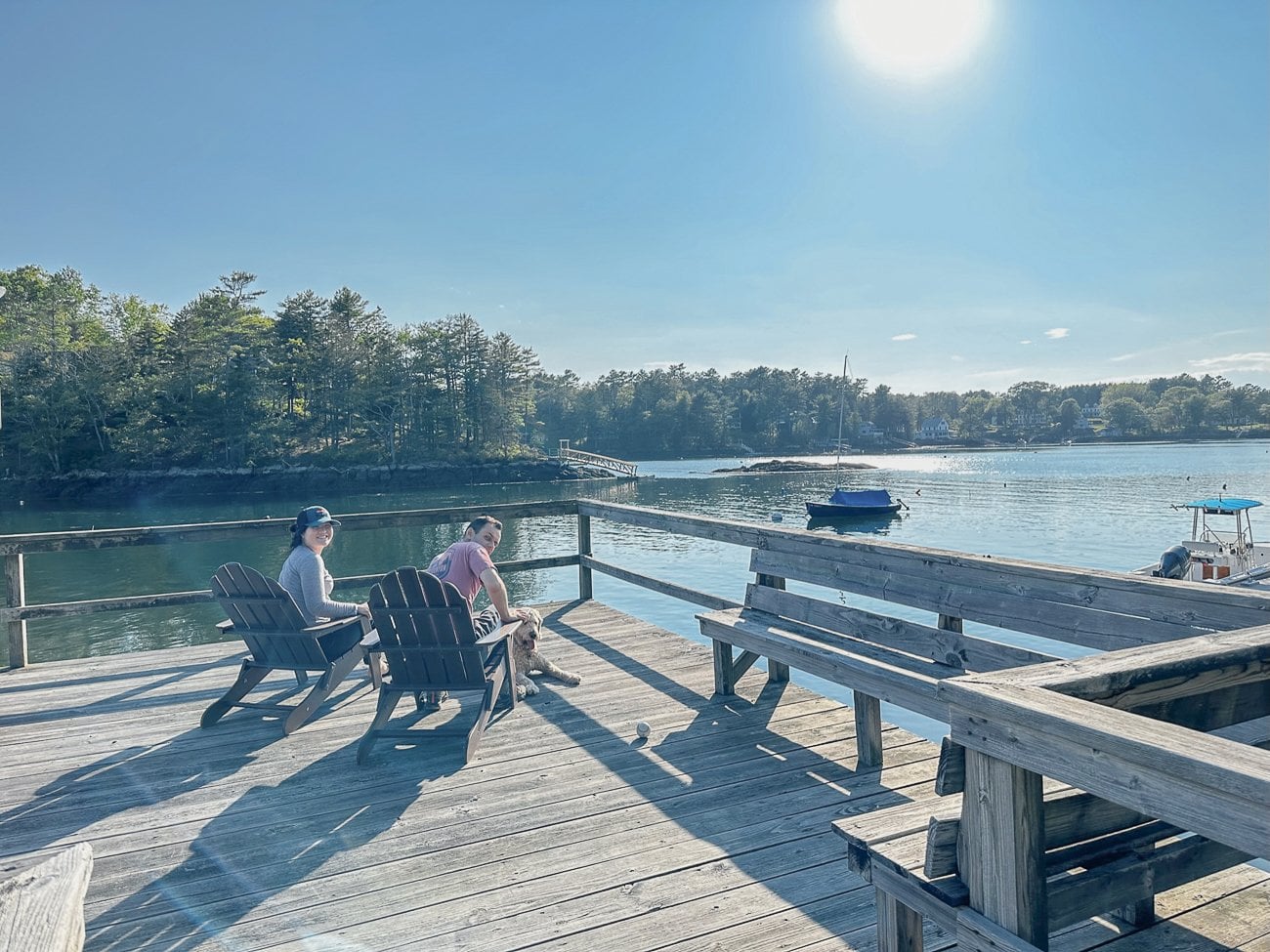 Sarah and Justin relaxing by the dock in Southport, Maine