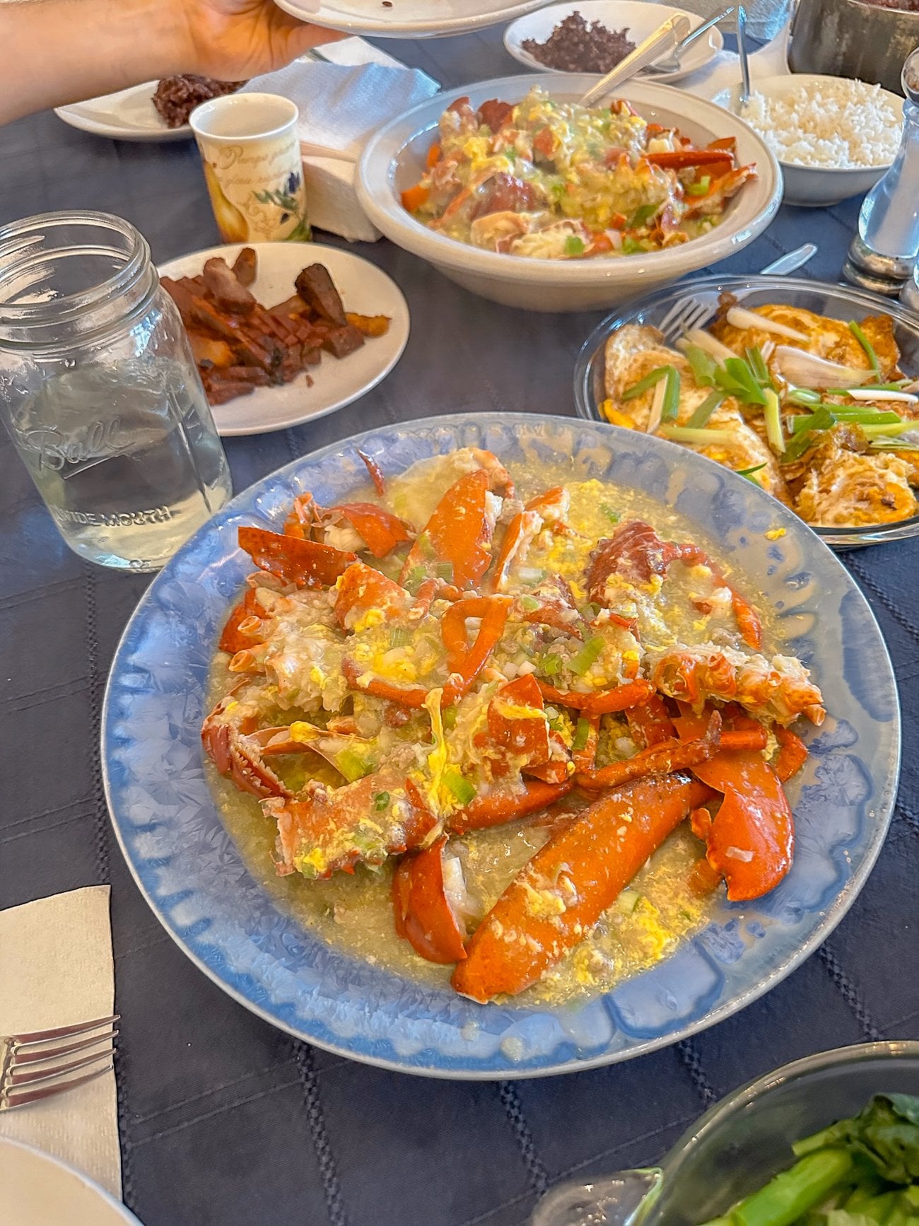 Lobster Cantonese on a blue Edgecomb Potter platter