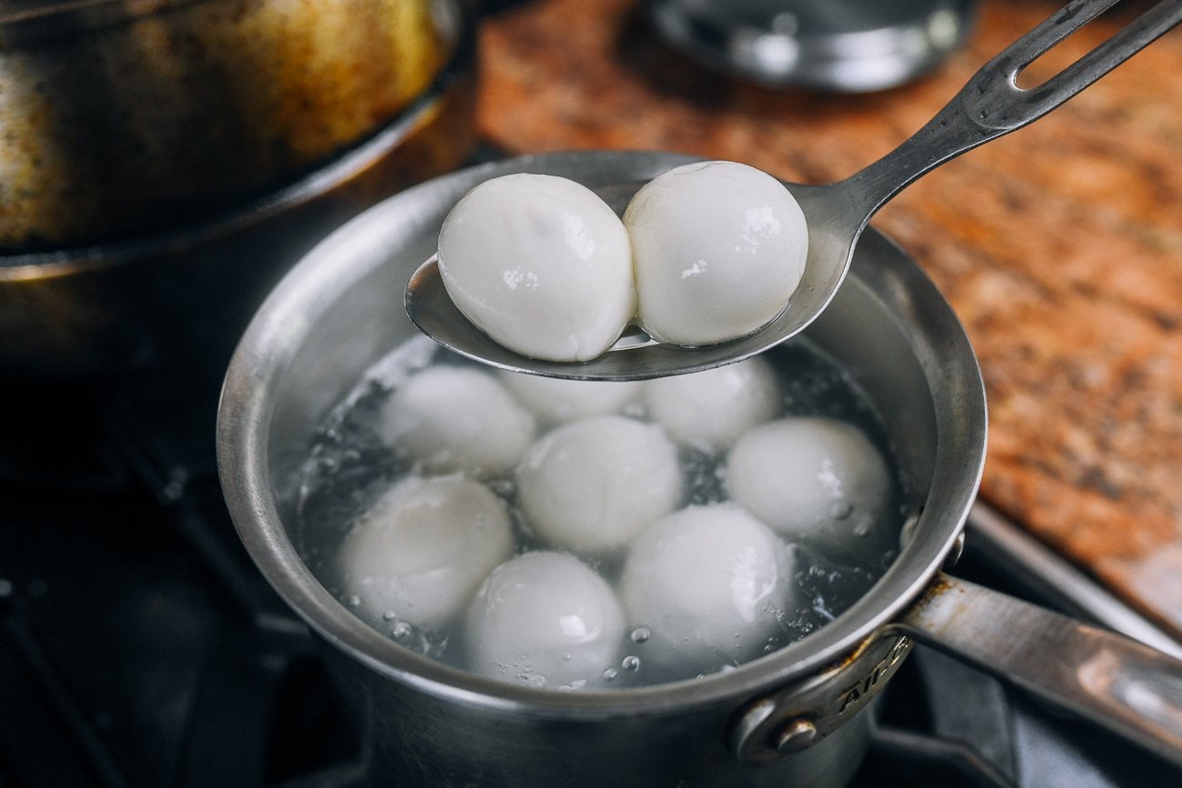 tang yuan floating at top of boiling water