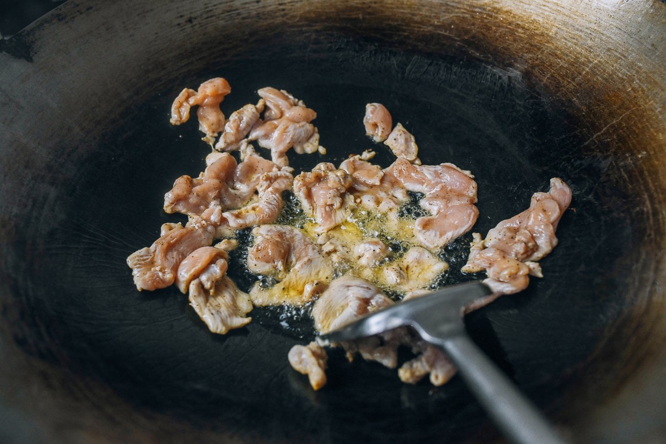 chicken pieces in hot wok