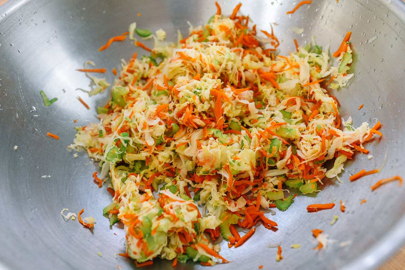 blanched shredded vegetables for egg rolls in large metal bowl