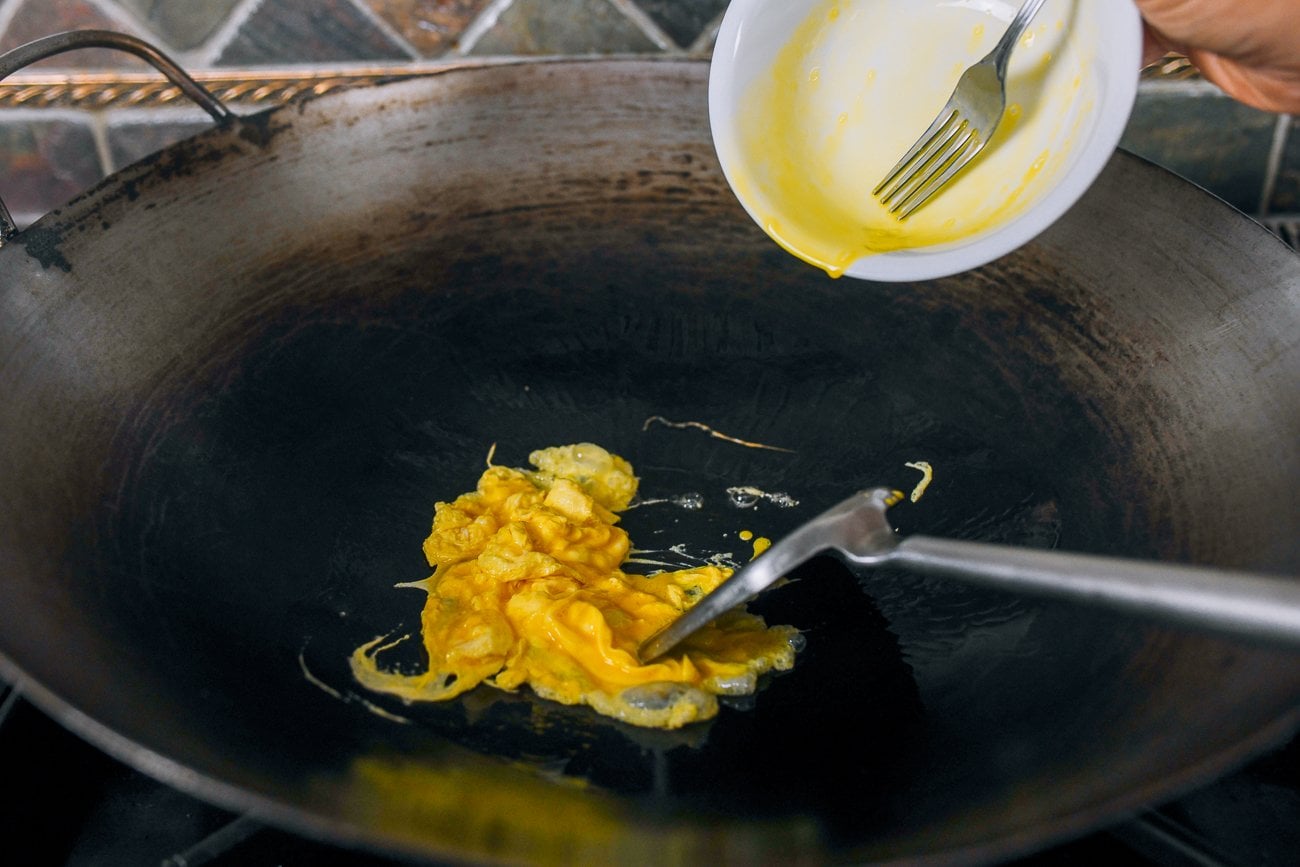 scrambling egg in a wok