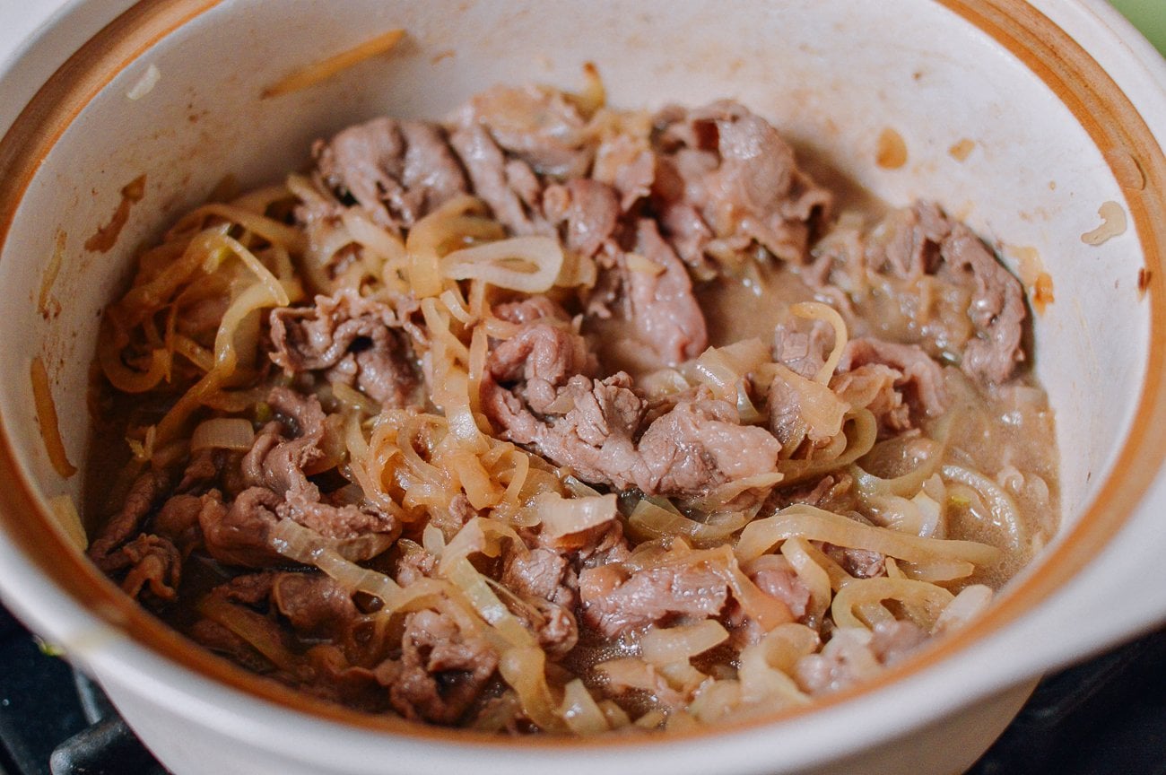 cooking gyudon with onions