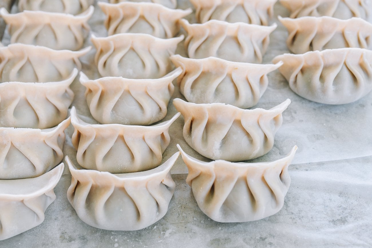 assembled dumplings on parchment paper
