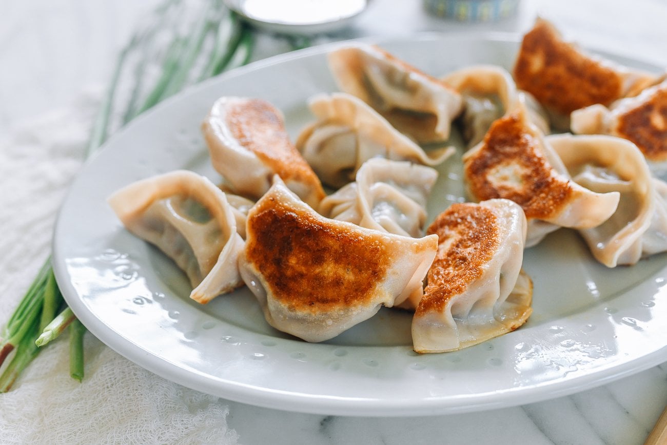 plate of pan-fried pork and chive dumplings