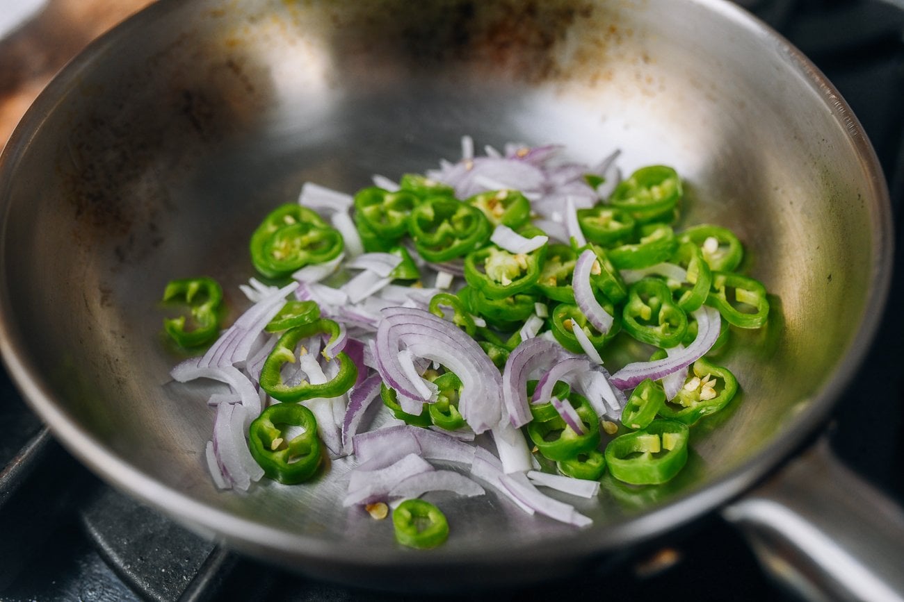peppers and shallots toasting in dry pan