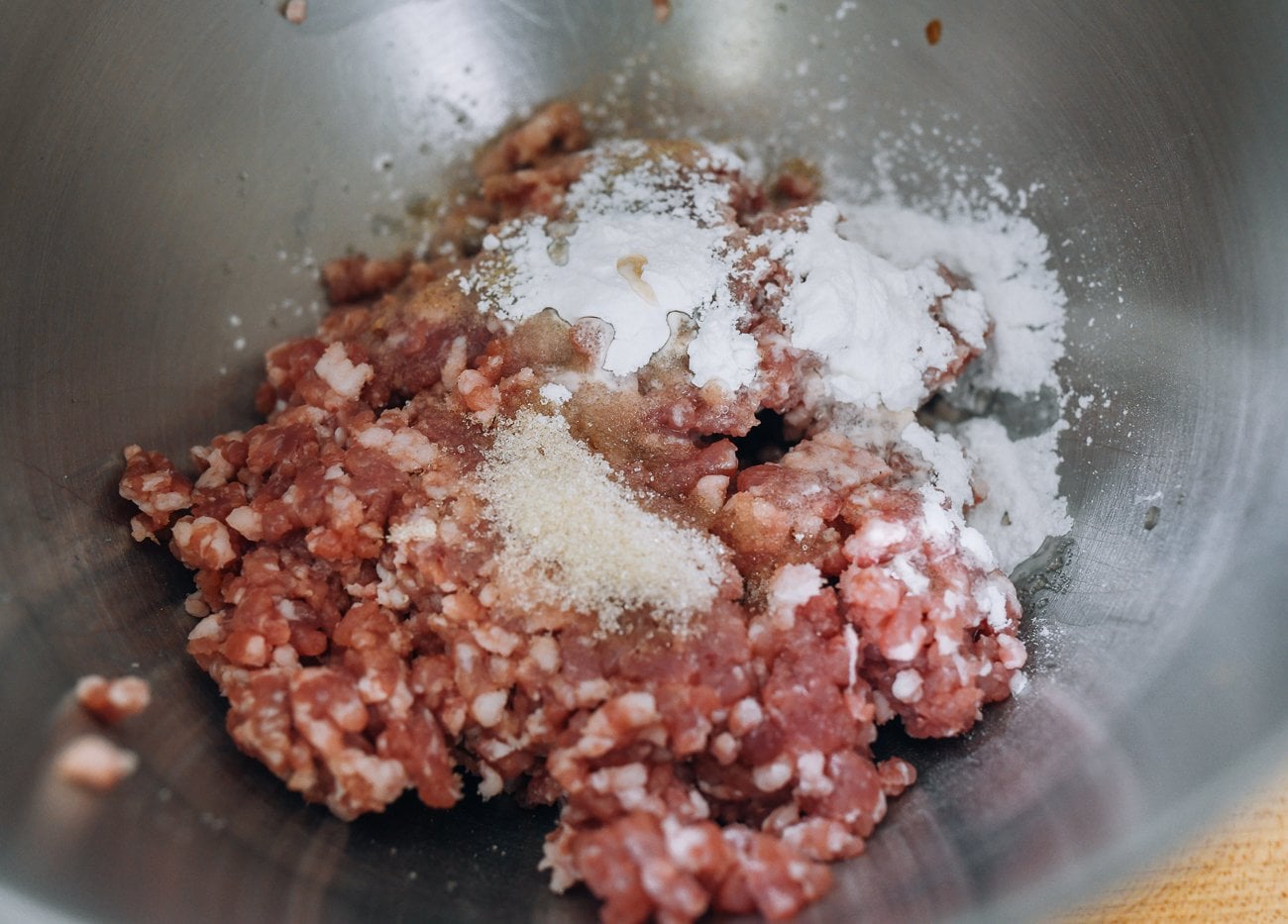 siu mai filling ingredients in metal stand mixer bowl