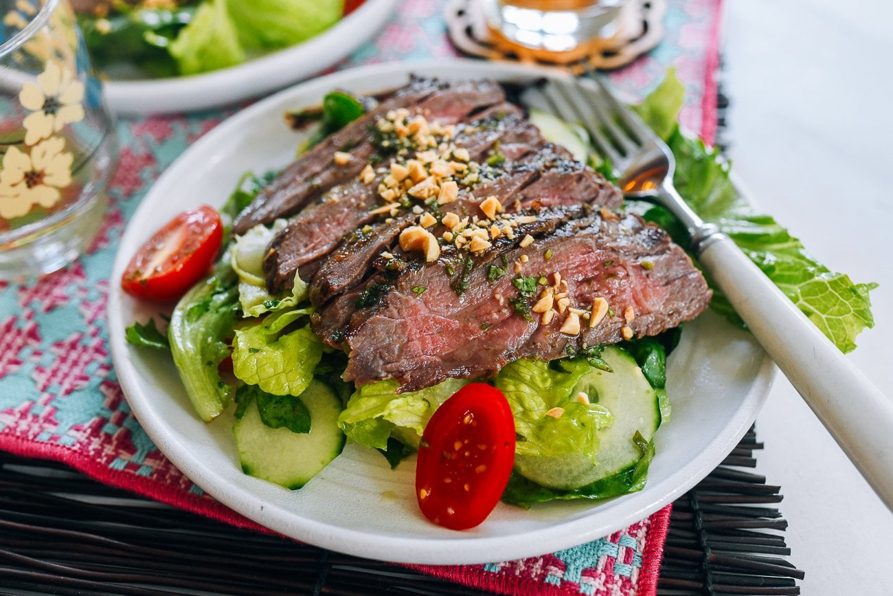 Plate of Thai Beef Salad with chopped peanuts