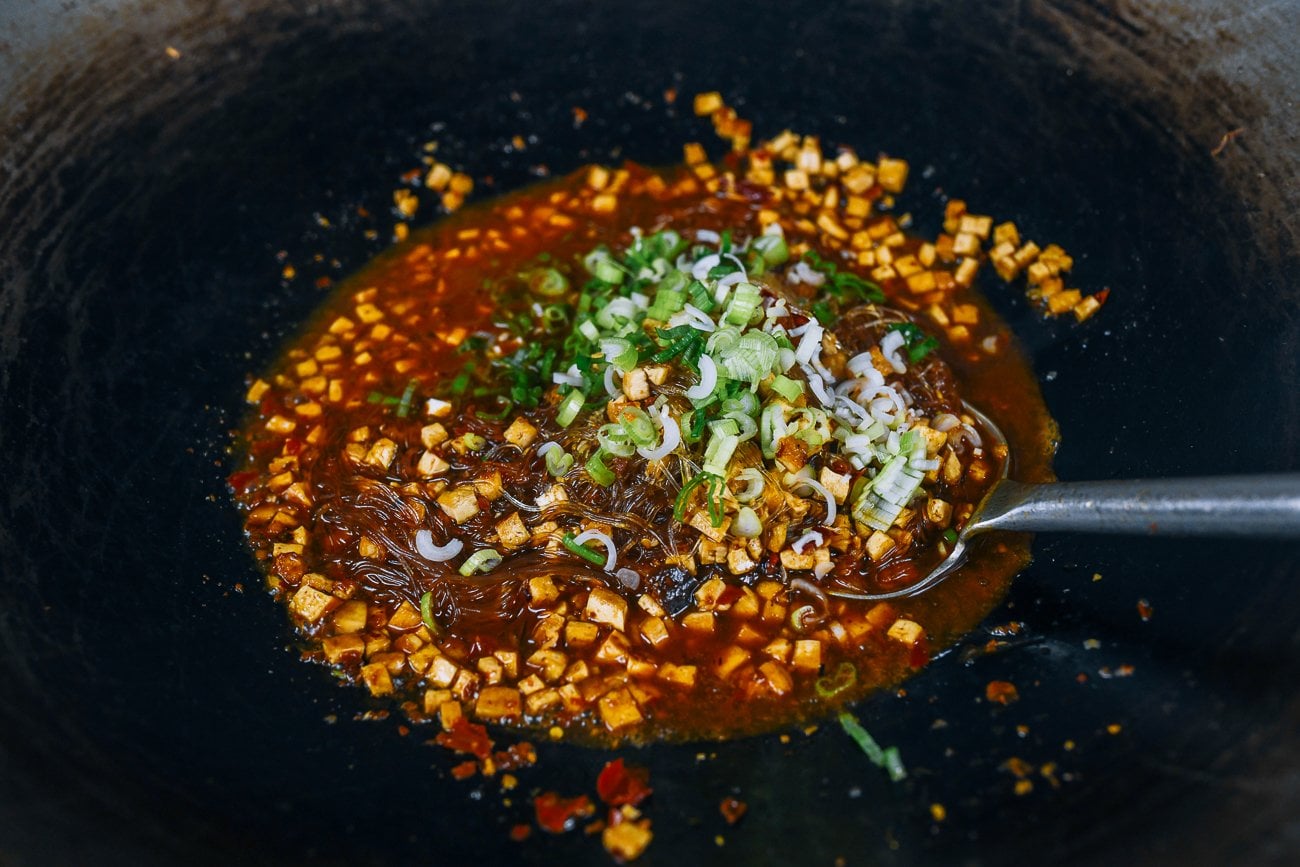 adding scallions to vegan ants climbing a tree