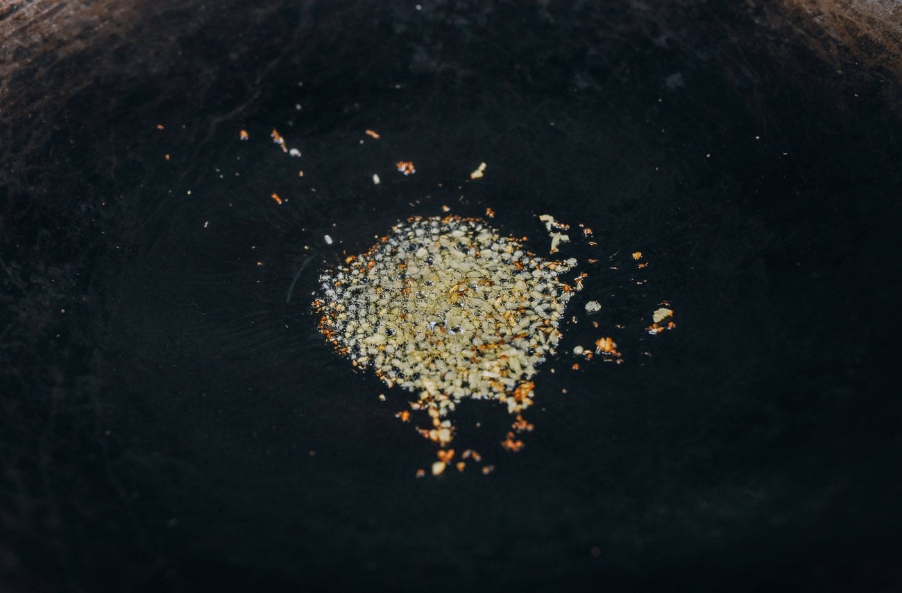 cooking ginger in oil in wok