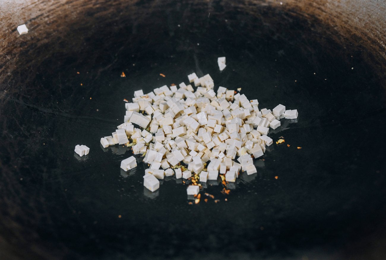 finely diced tofu in wok
