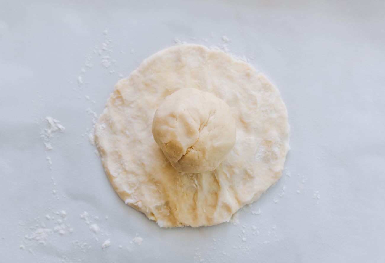 oil dough ball on top of disc of water dough