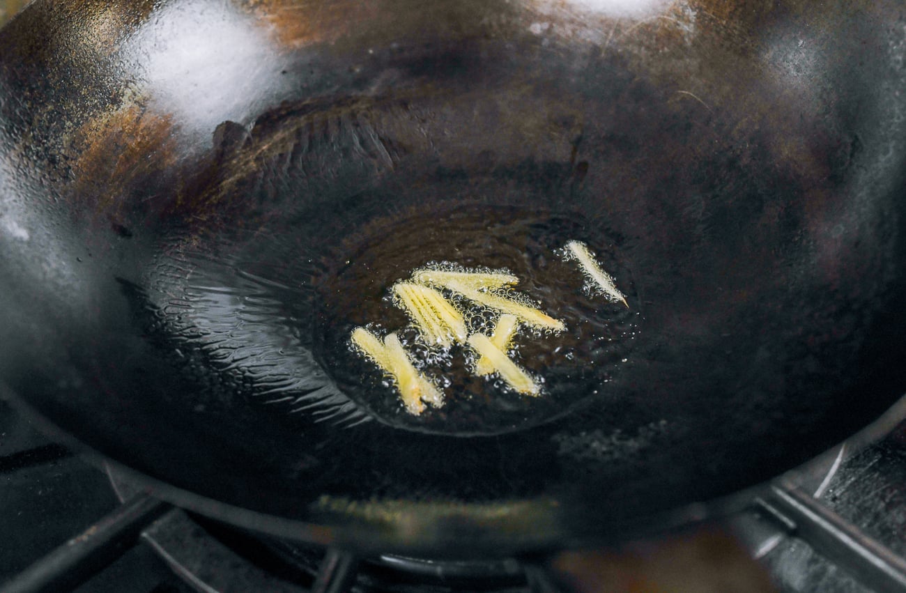 julienned ginger in wok