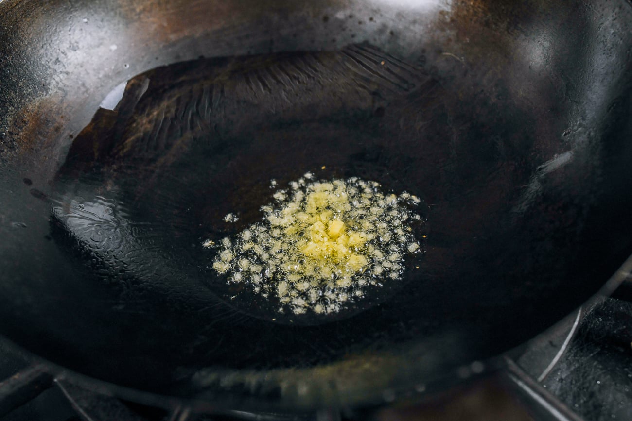 minced ginger in wok