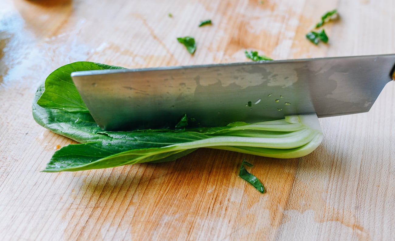cutting shanghai baby bok choy lengthwise 