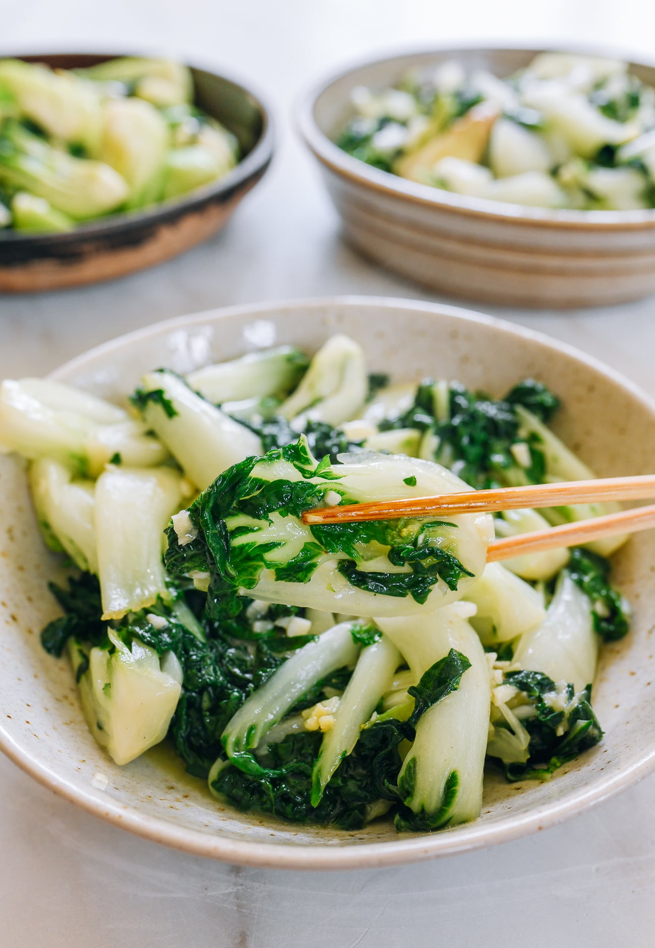 picking up piece of bok choy