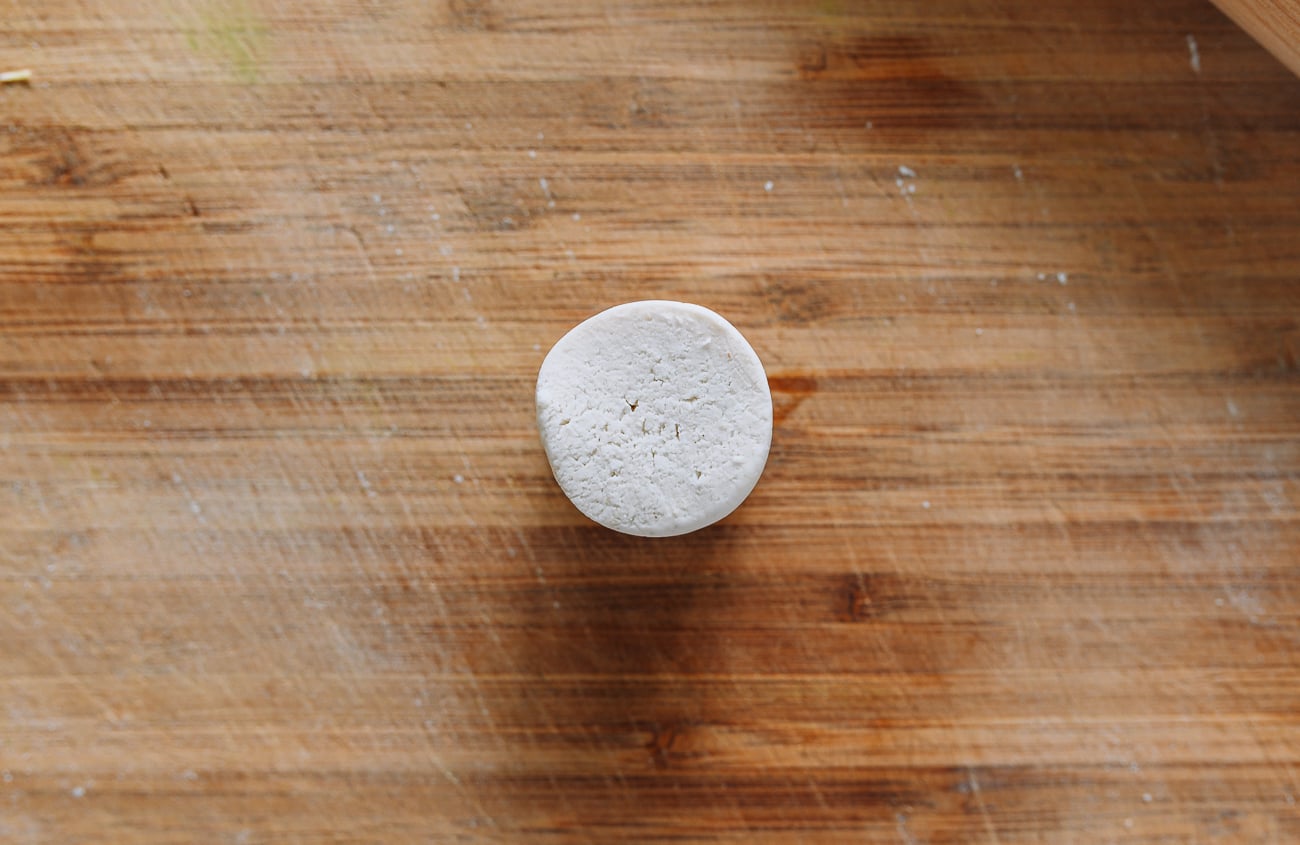 gluten-free dough on bamboo cutting board