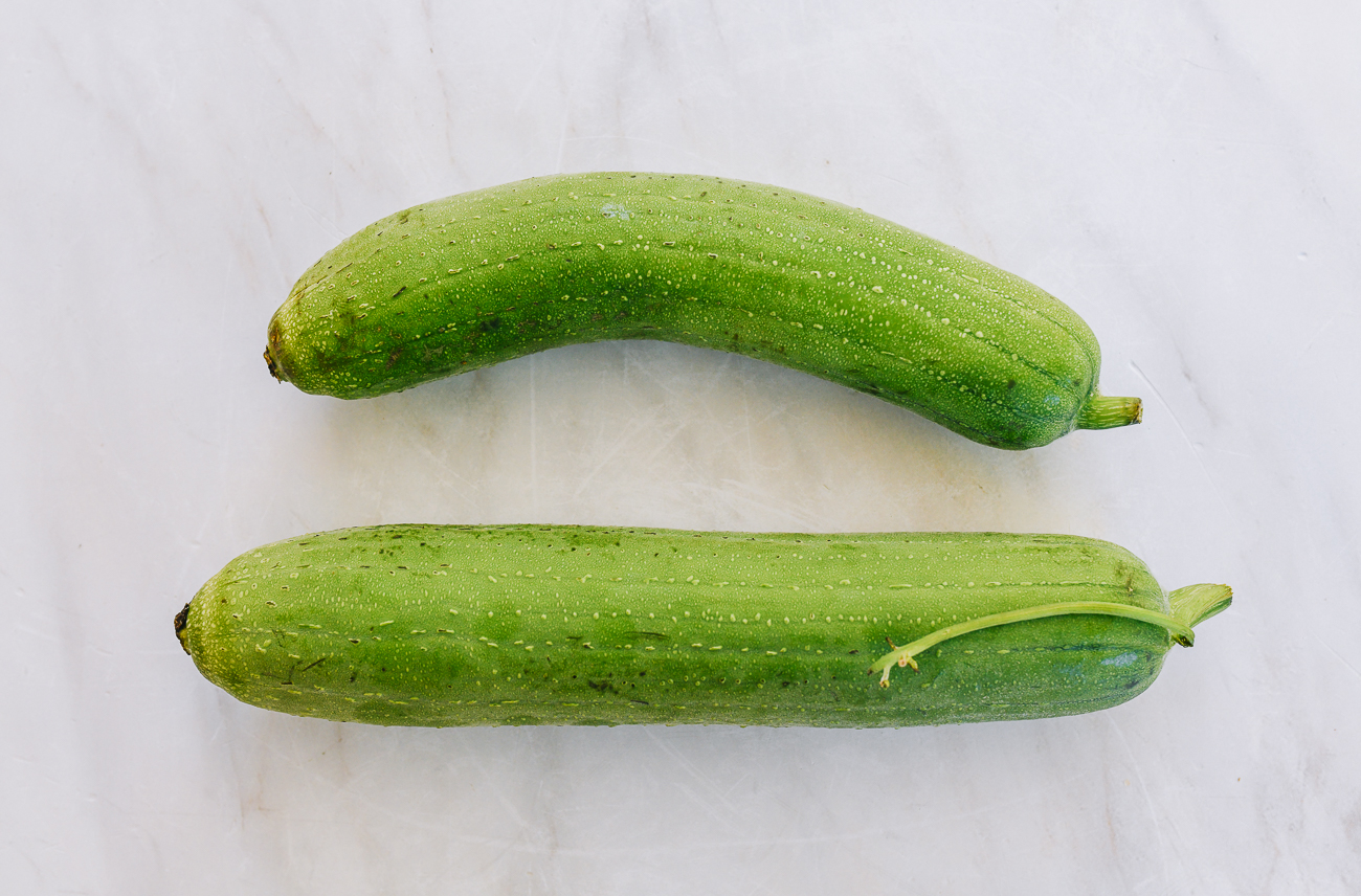Luffa fruits on white countertop