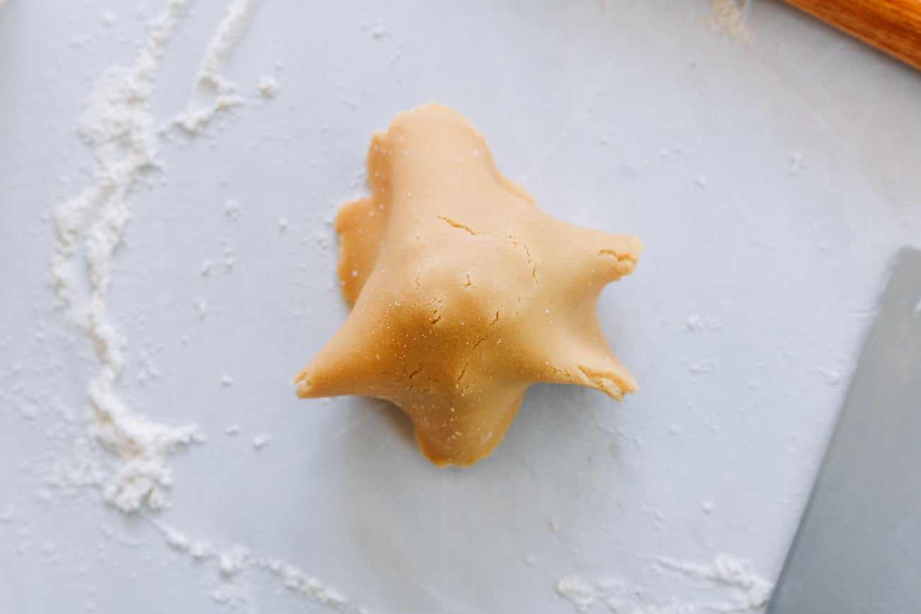 mooncake dough placed on top of filling