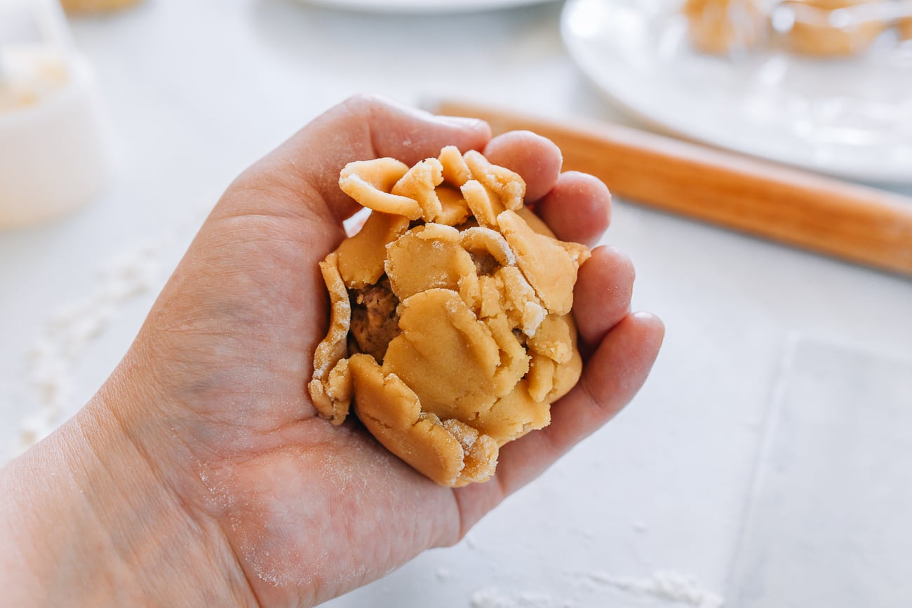 wrapping dough around filling