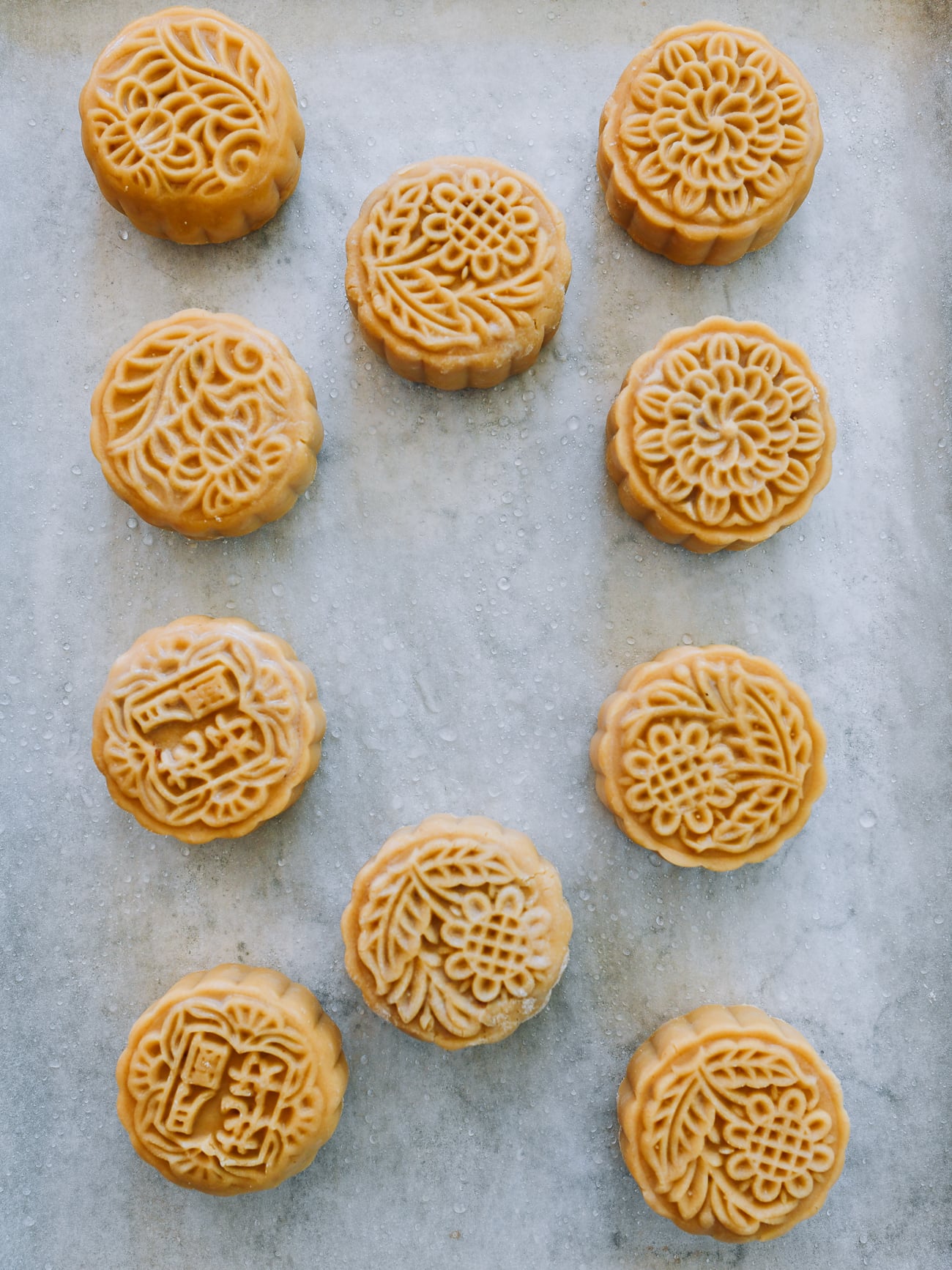 mooncakes on baking sheet