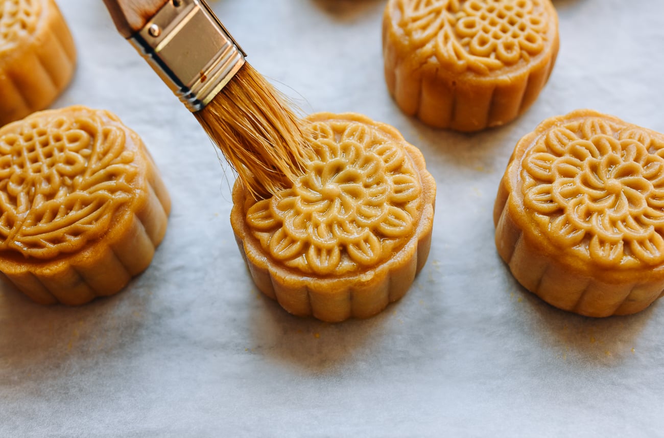 brushing mooncake with light egg wash