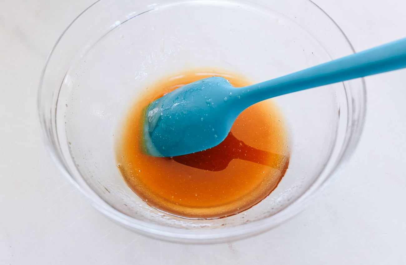 golden syrup, oil, and potassium carbonate in glass bowl