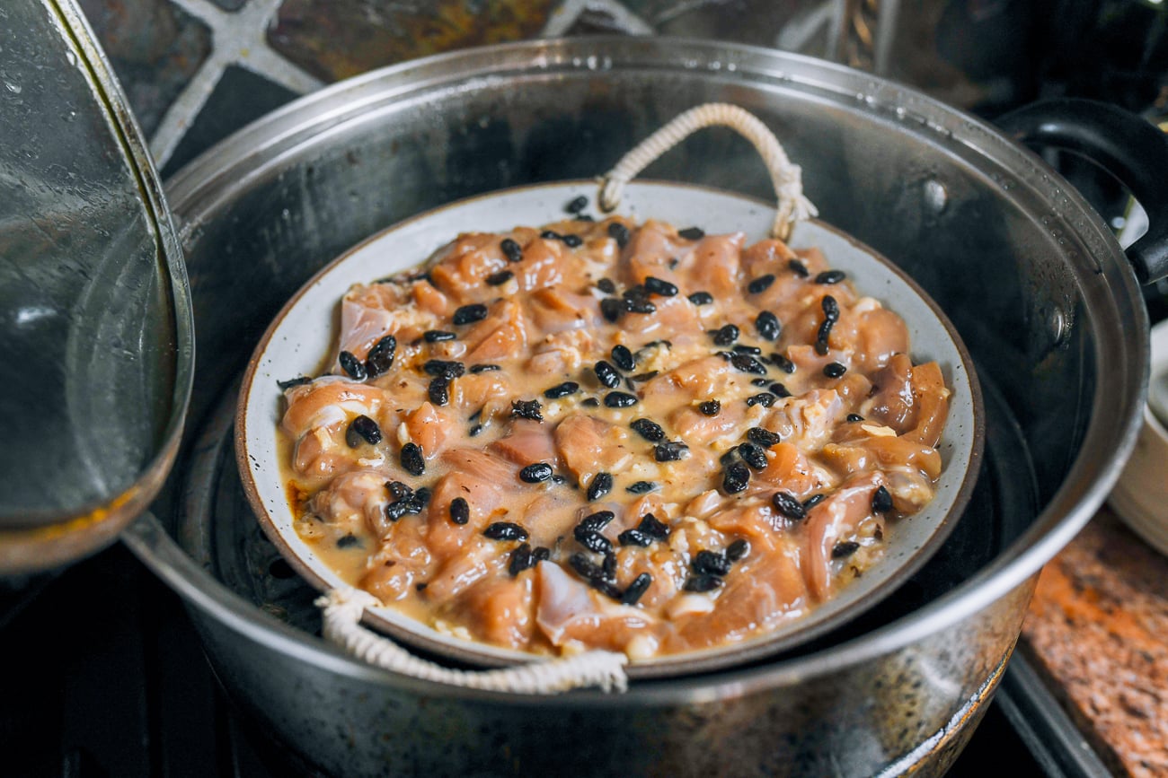 dish of chicken in metal steamer