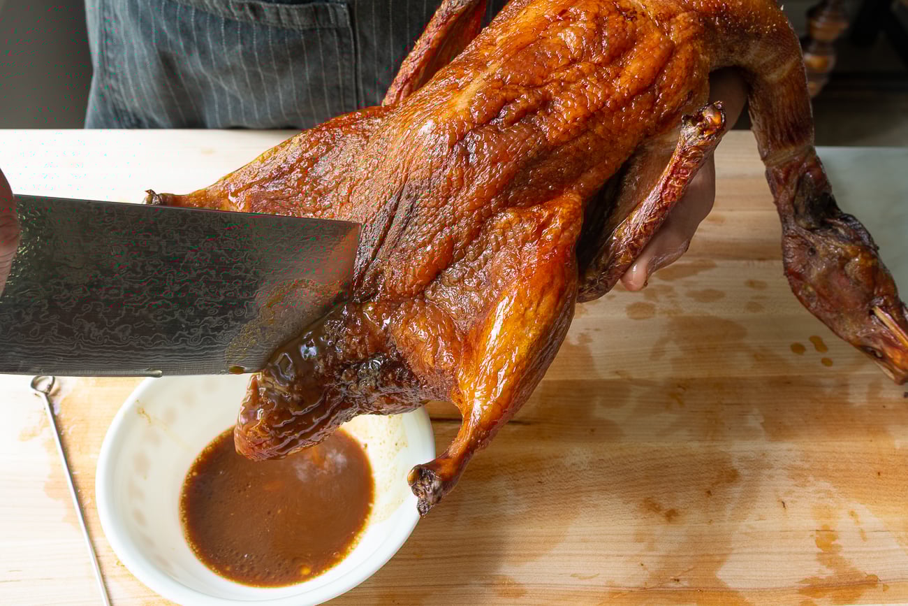 cutting open duck cavity to release juices