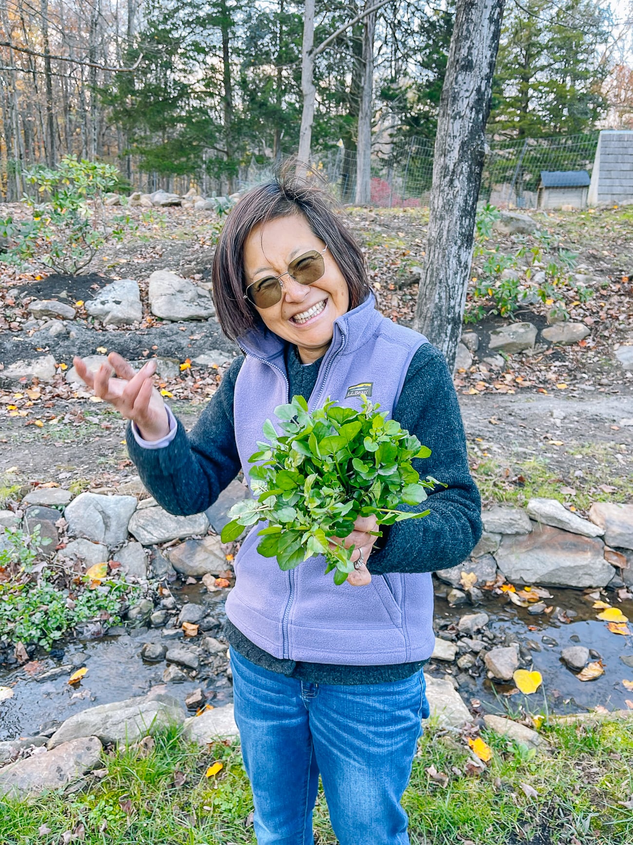 Judy holding up watercress harvest