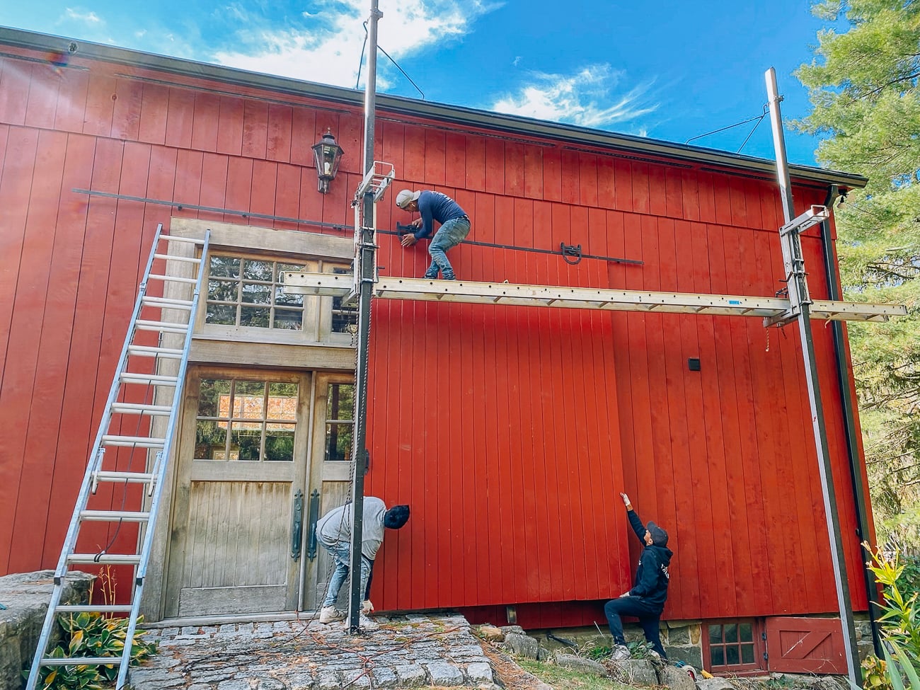 working on new siding for barn