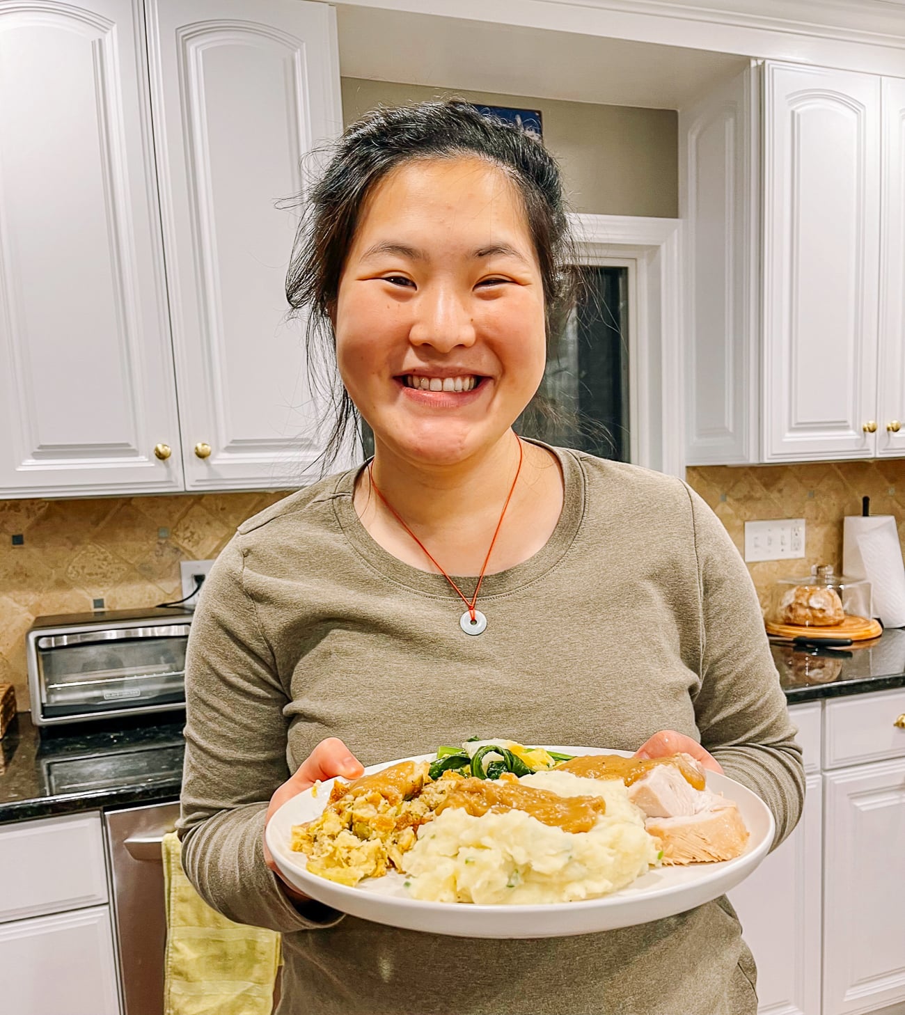 Sarah with Thanksgiving dinner plate