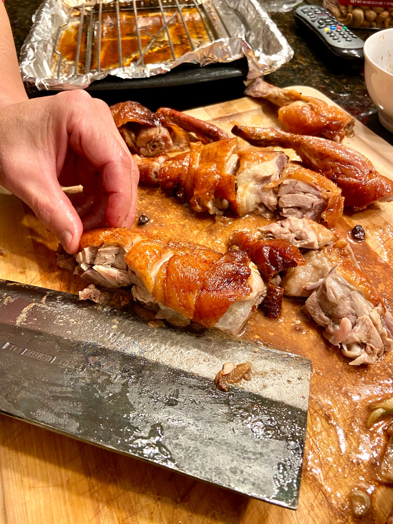 Carving Chinese roast duck recipe on cutting board