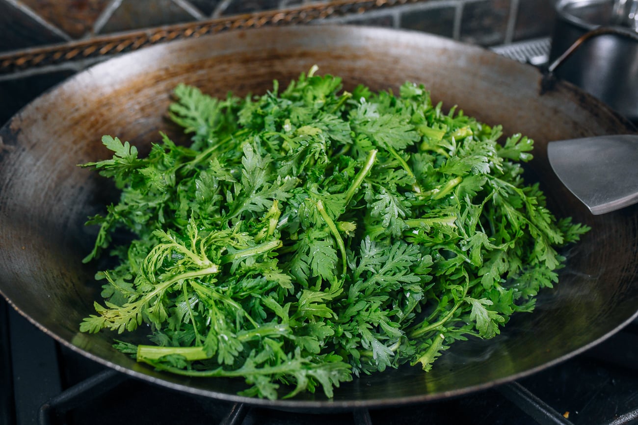 chrysanthemum greens or tong ho in wok