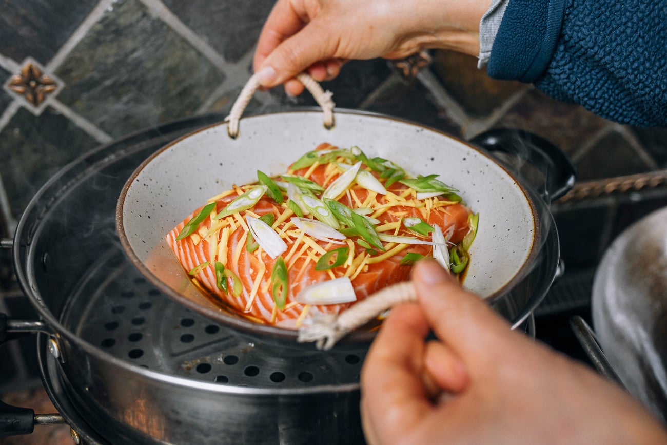 placing salmon fillet into steamer