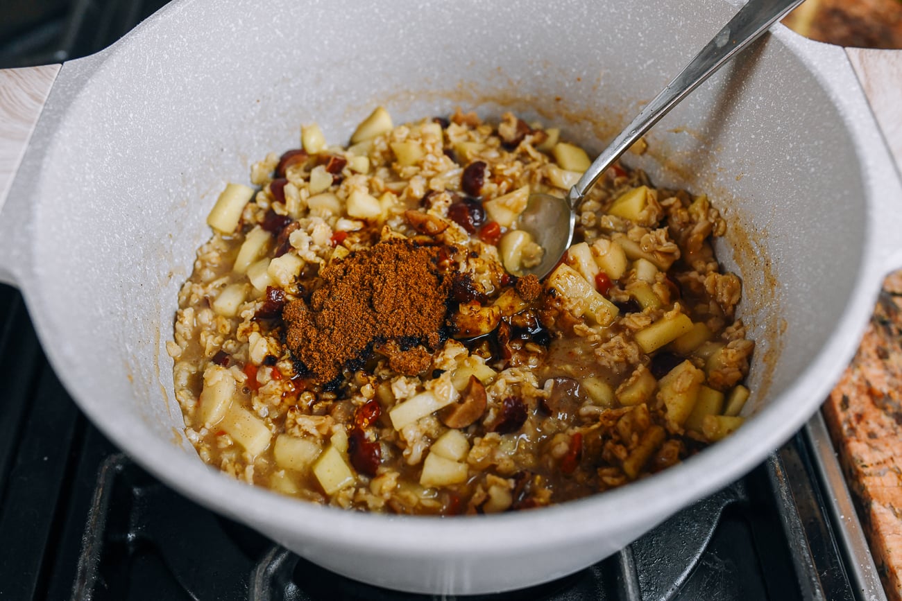 stirring brown sugar into apple cinnamon oatmeal