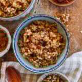 Bowl of Apple Cinnamon Oatmeal with Brown Sugar, Dates, Goji Berries, and Walnuts