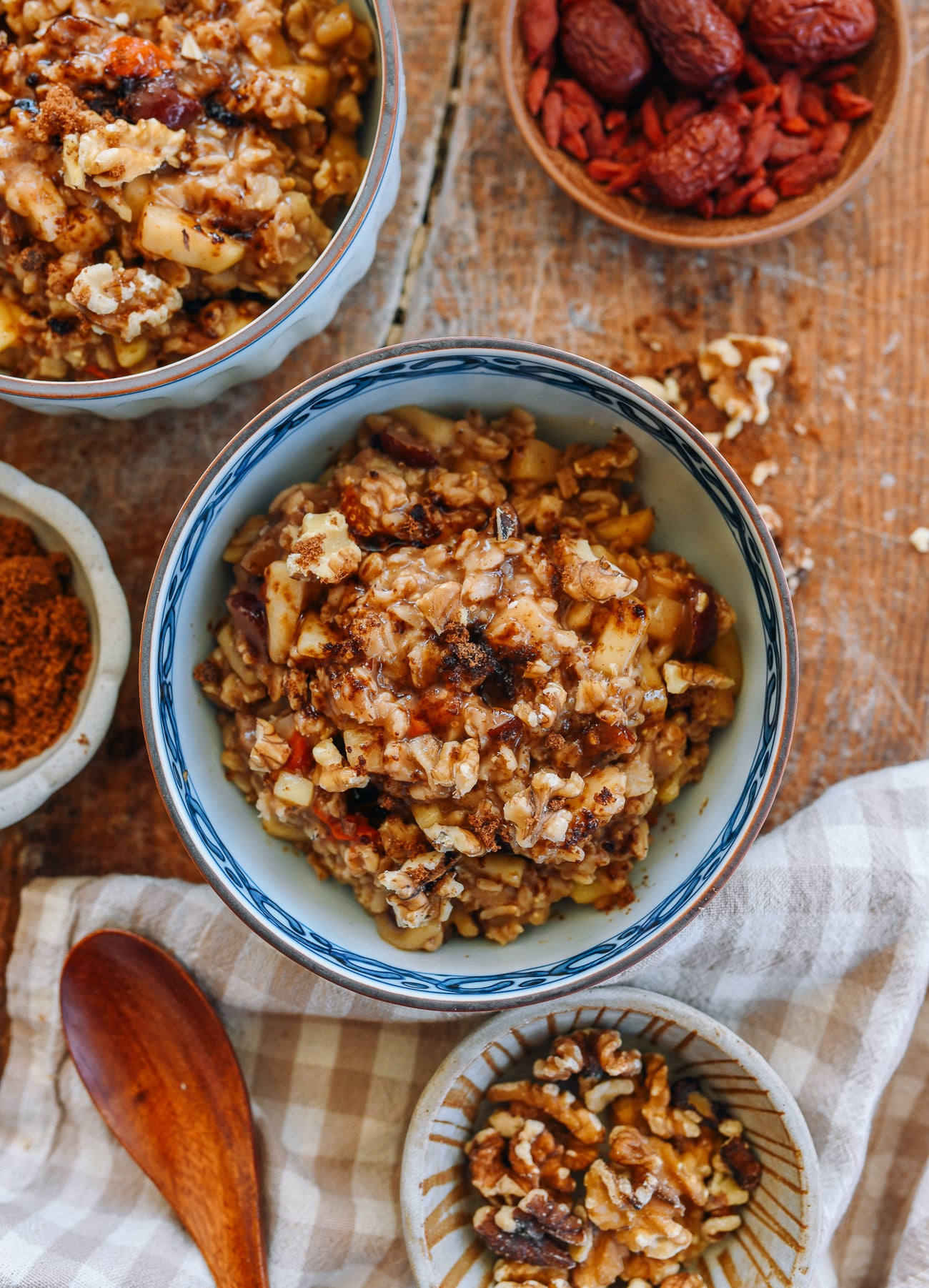 Bowl of Apple Cinnamon Oatmeal with Brown Sugar, Dates, Goji Berries, and Walnuts