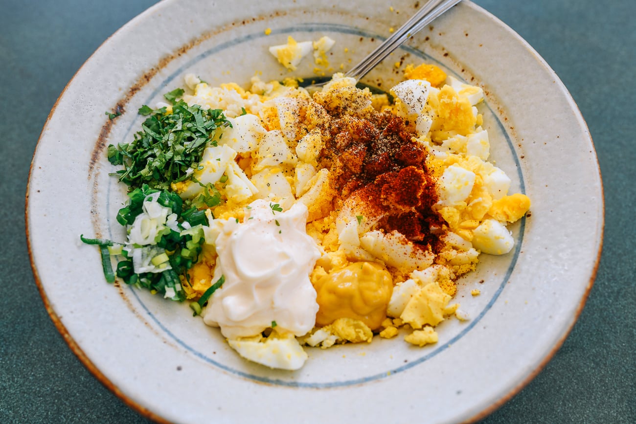 egg salad ingredients in bowl