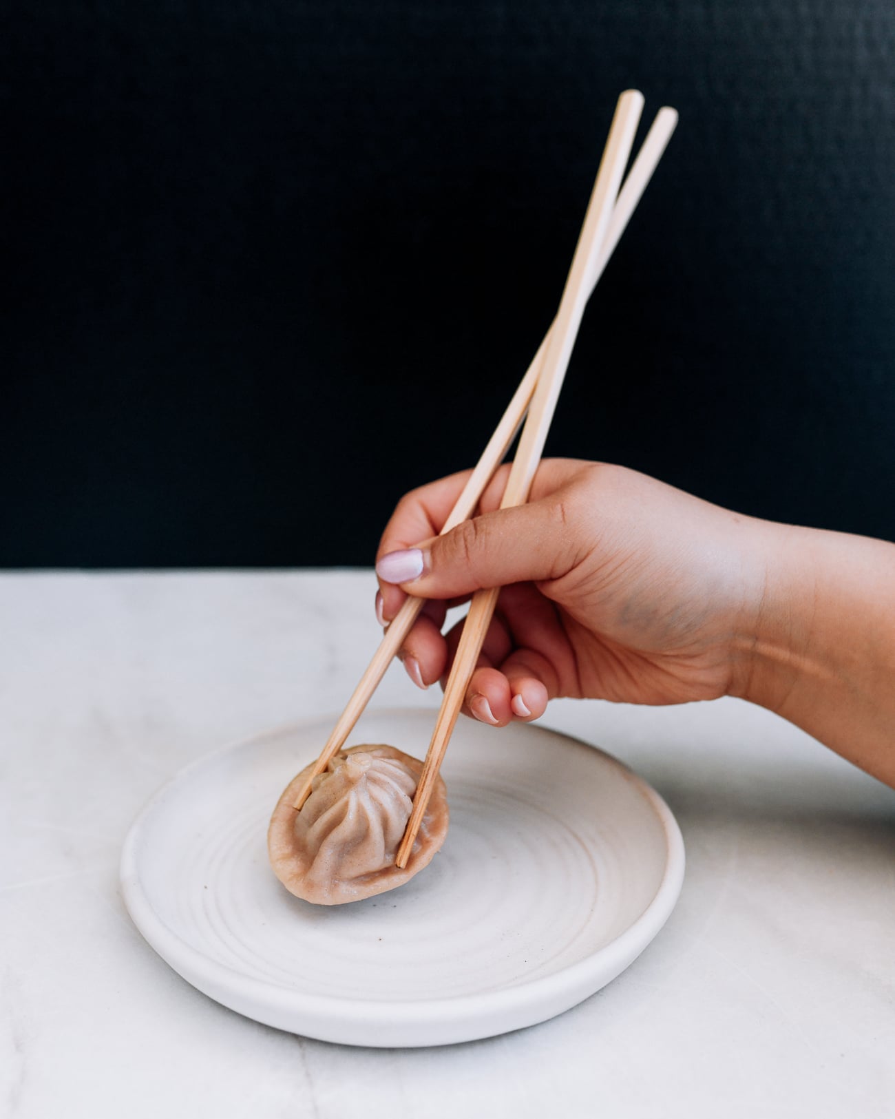 holding chopsticks with hand too low