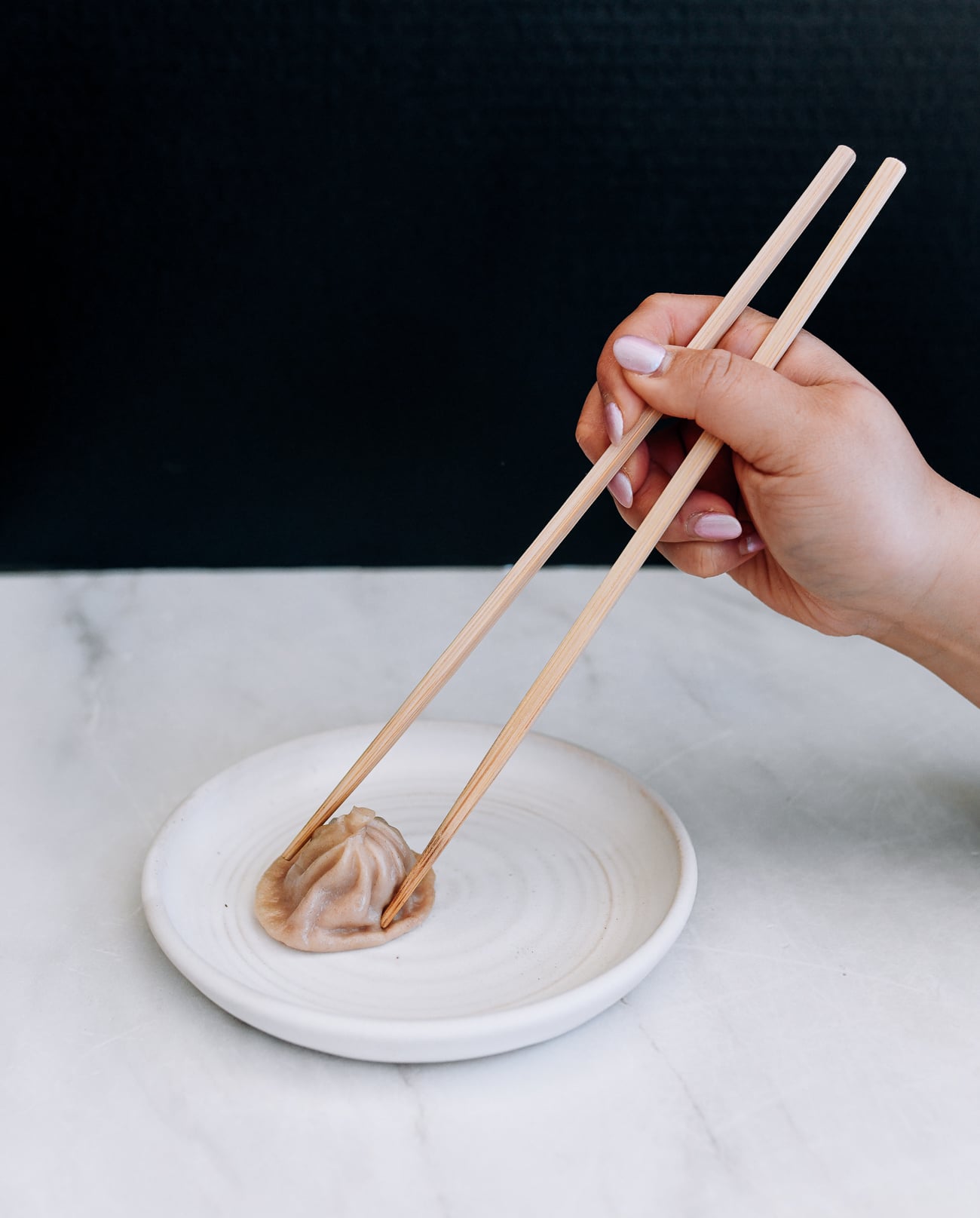 holding chopsticks too tightly