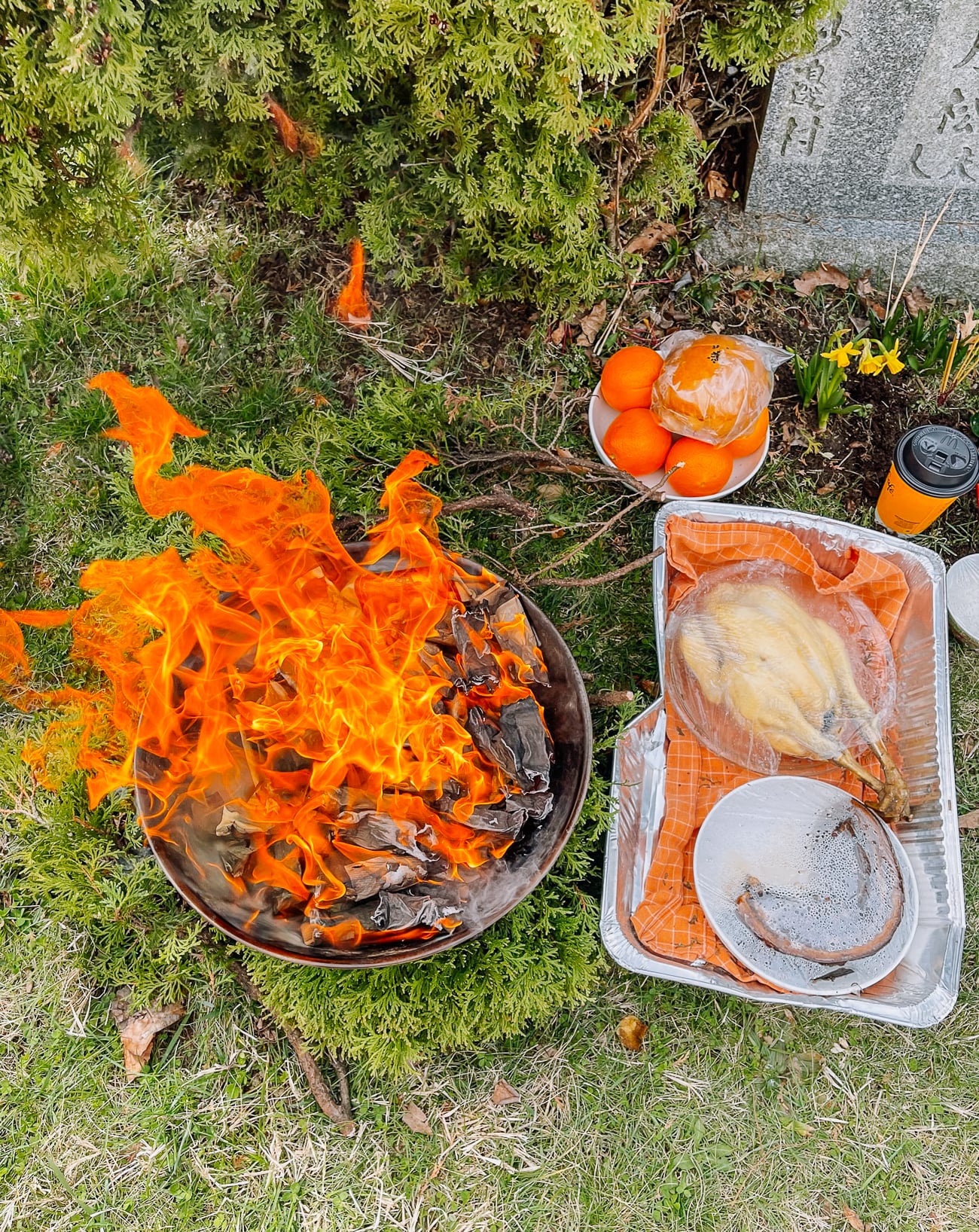 burning joss papers during qingming festival