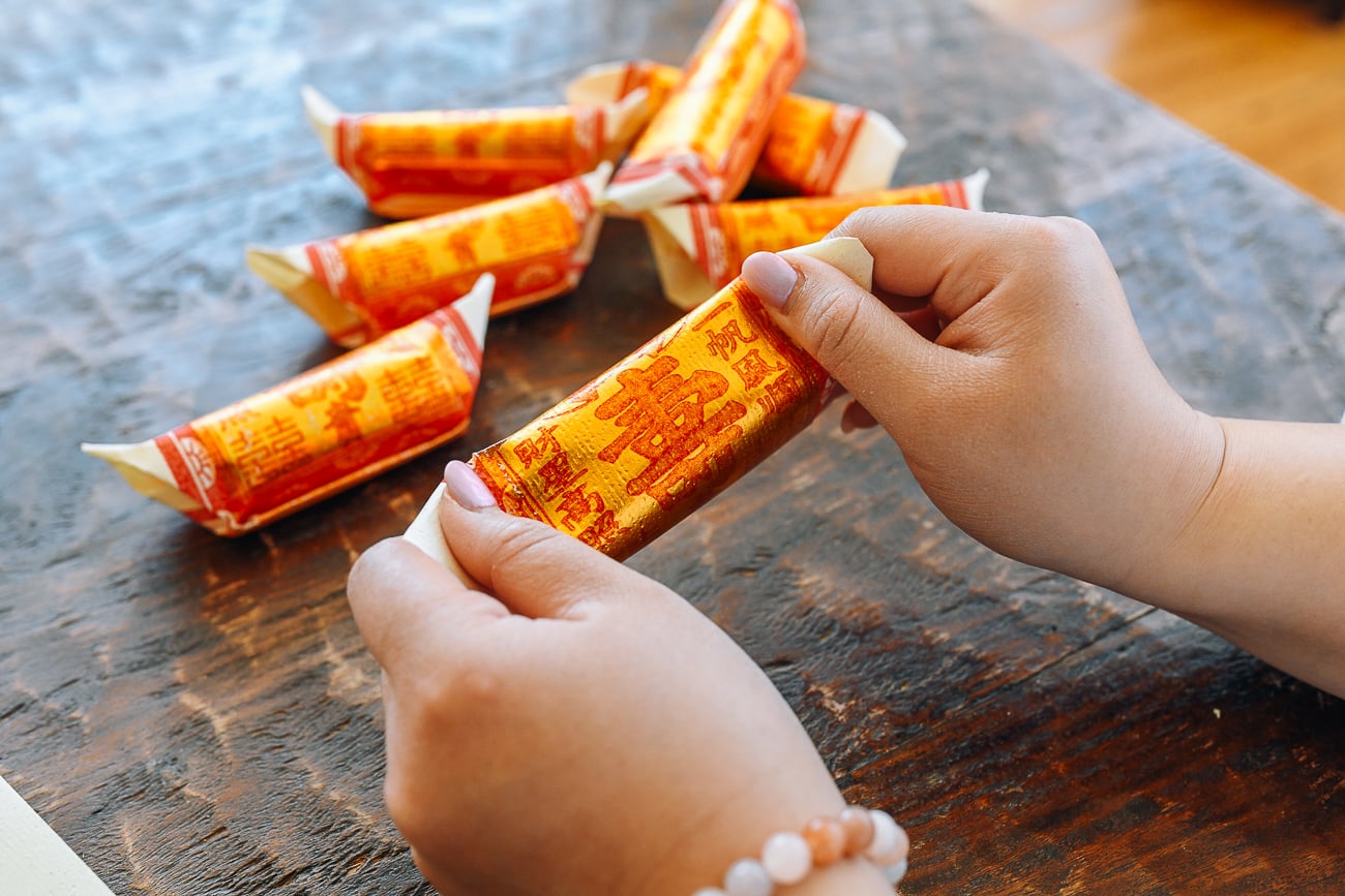 pointing the ends of joss paper tube up to make a gold bar