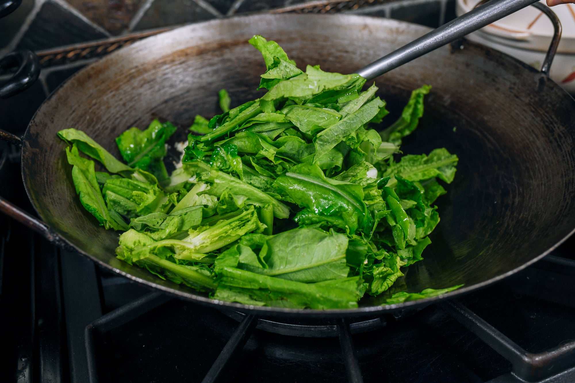 stirring A choy in wok