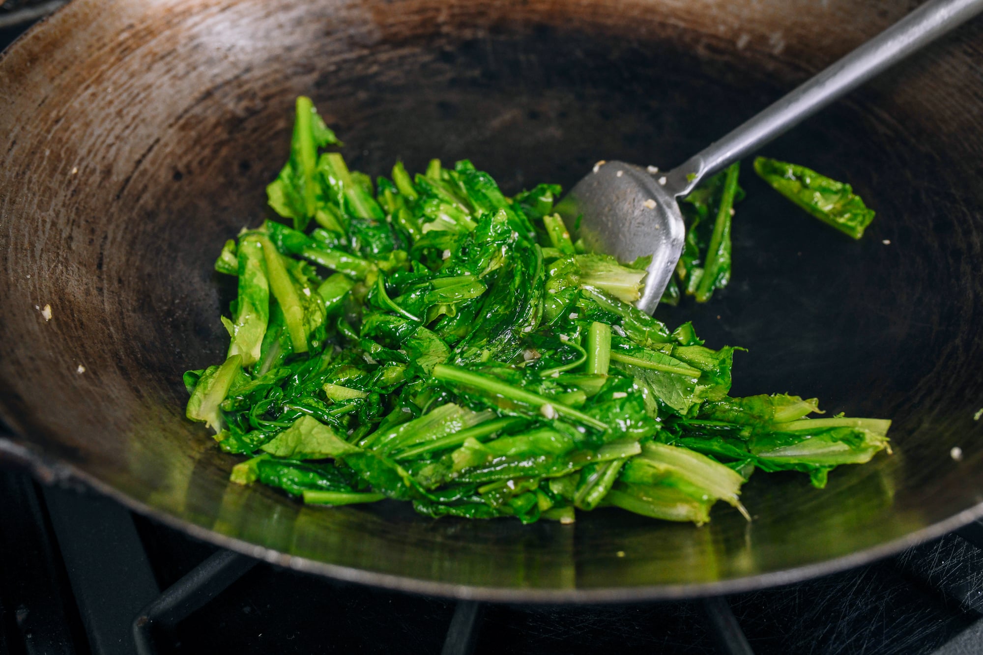 wilted AA choy in wok