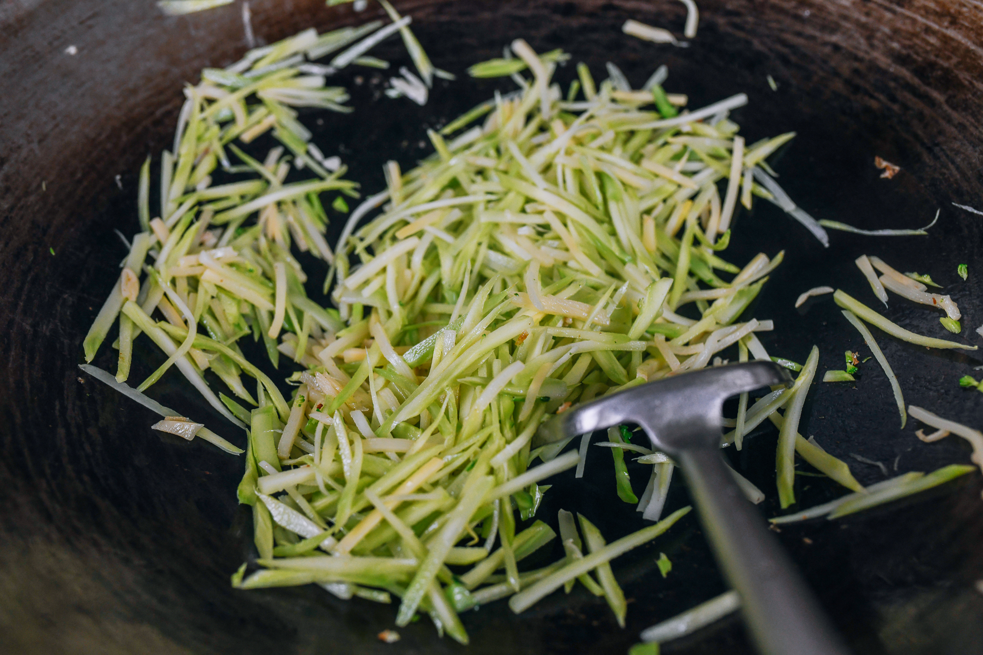 stir-frying bamboo shoots and broccoli stems together