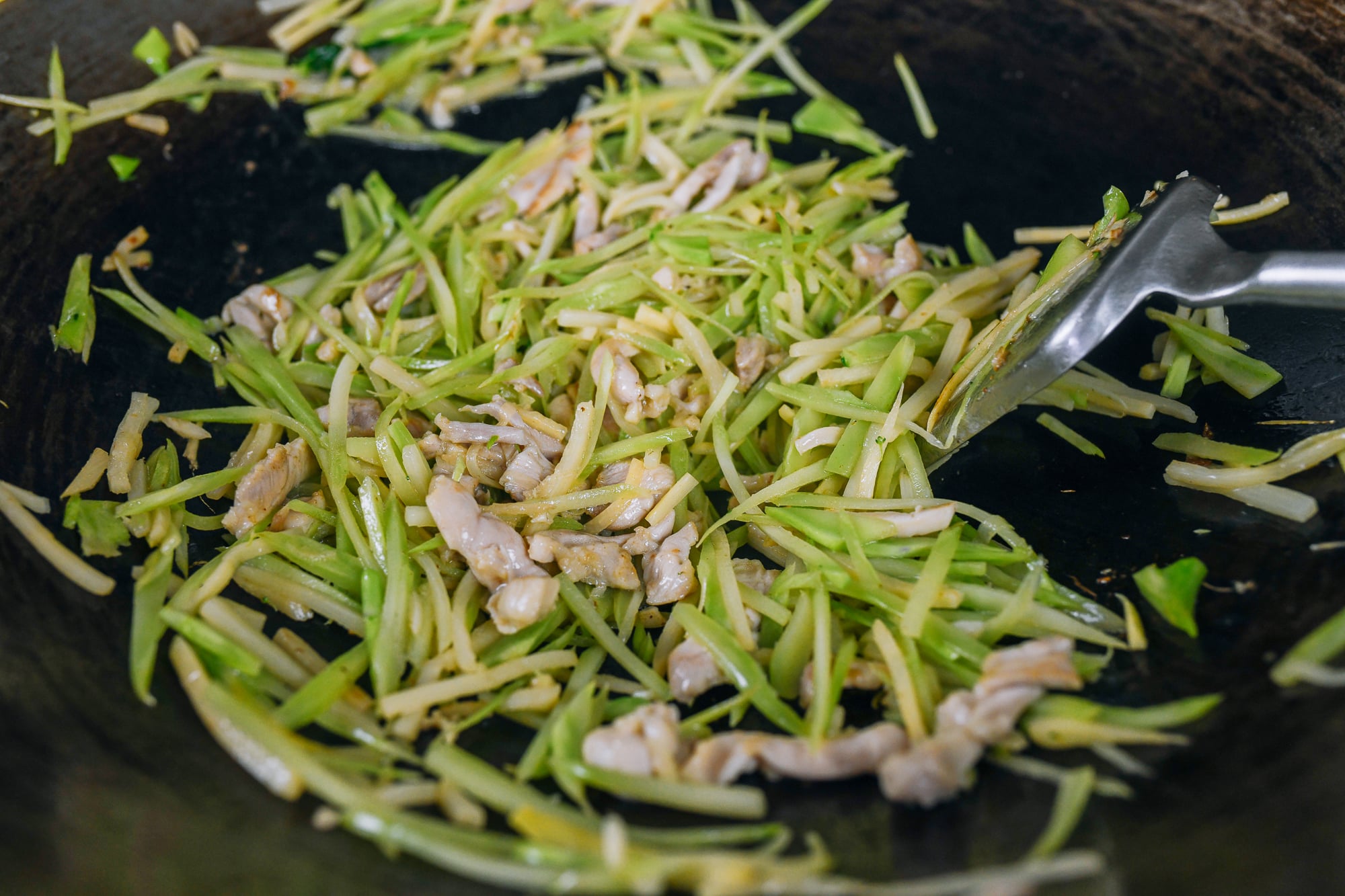 stir-frying chicken with broccoli stem and bamboo