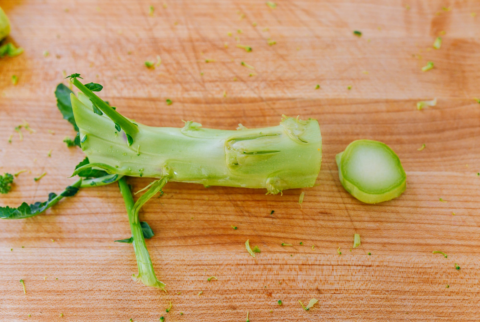 trimming the end off of a broccoli stem