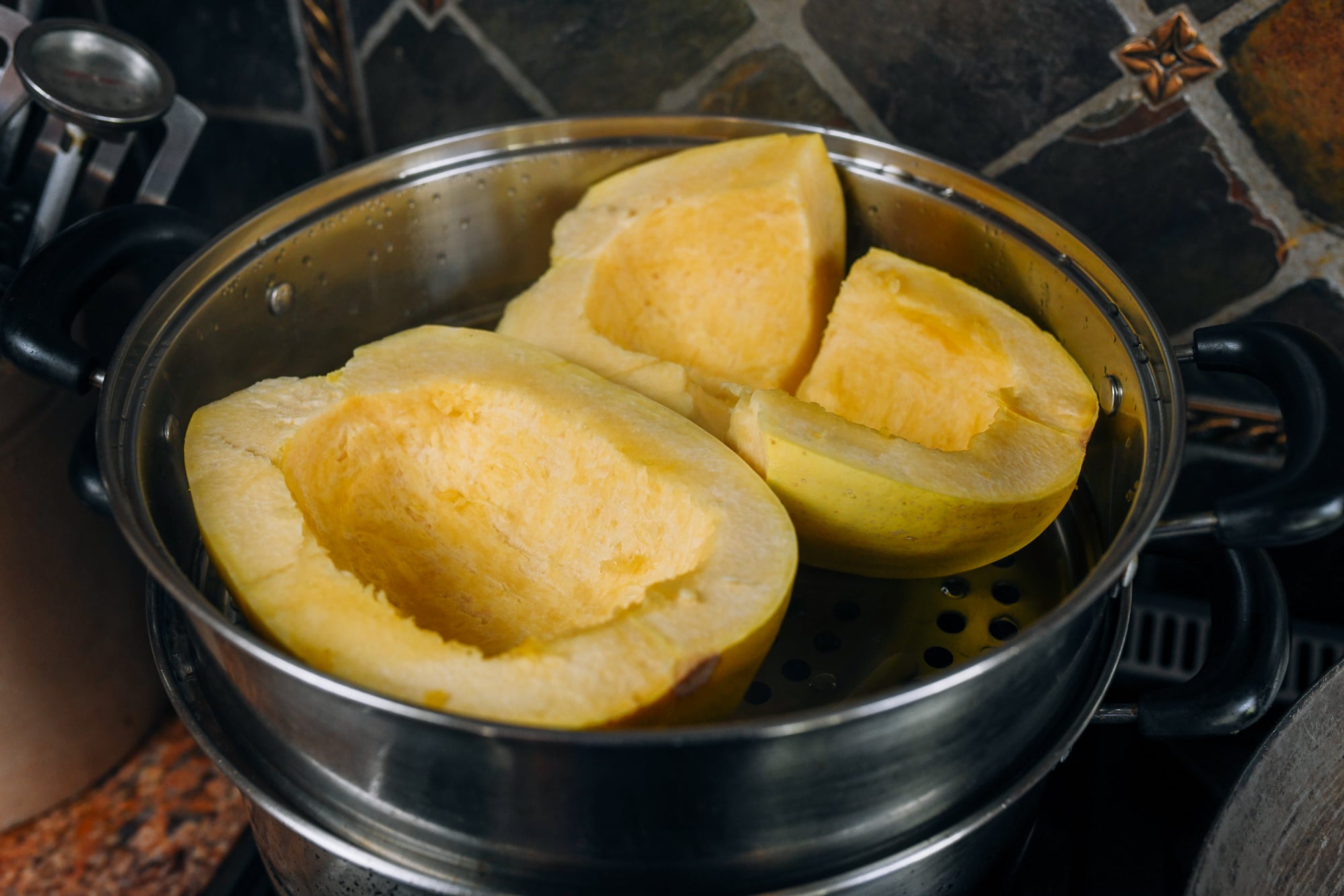 Spaghetti squash halves in steamer