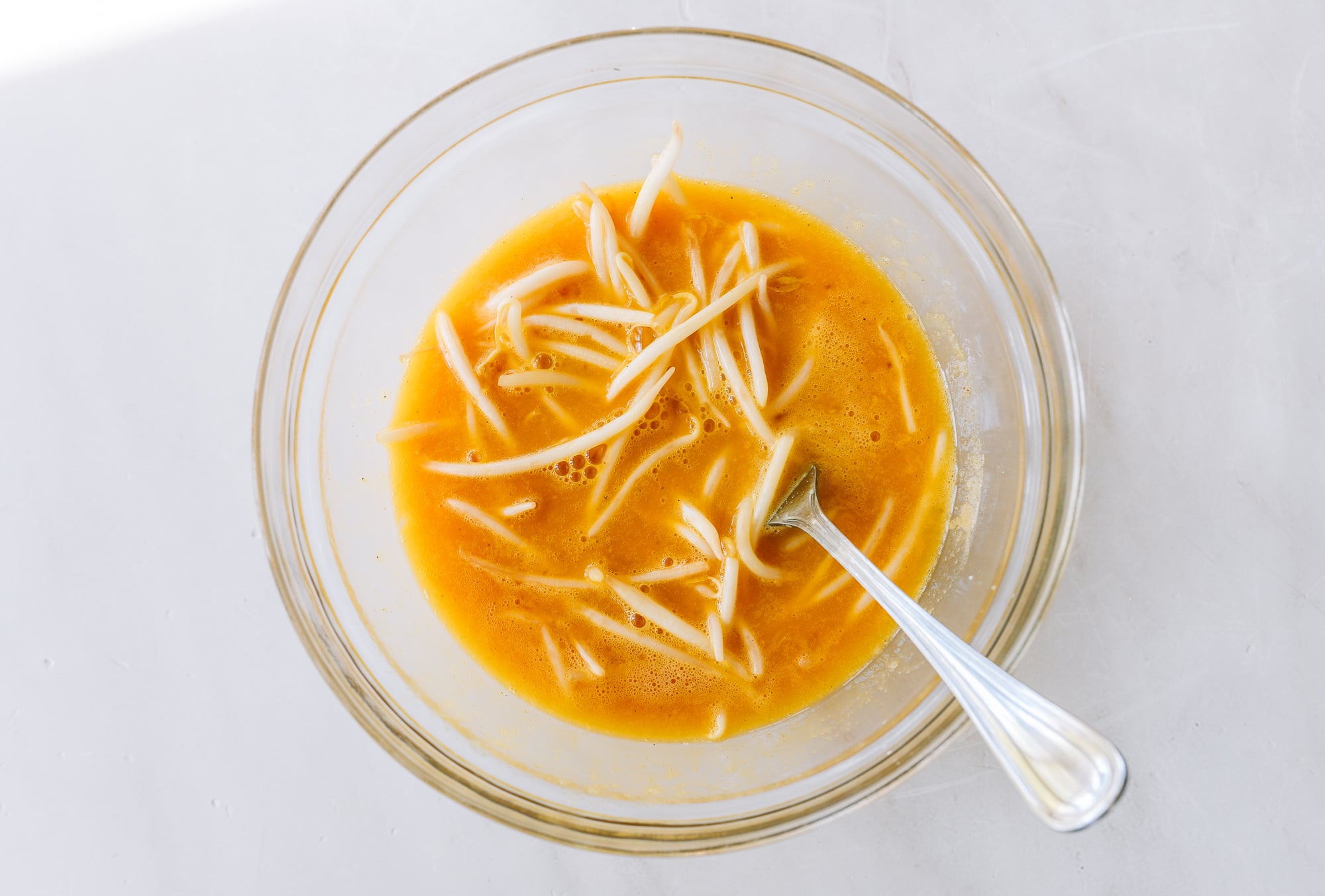 bean sprouts in beaten eggs